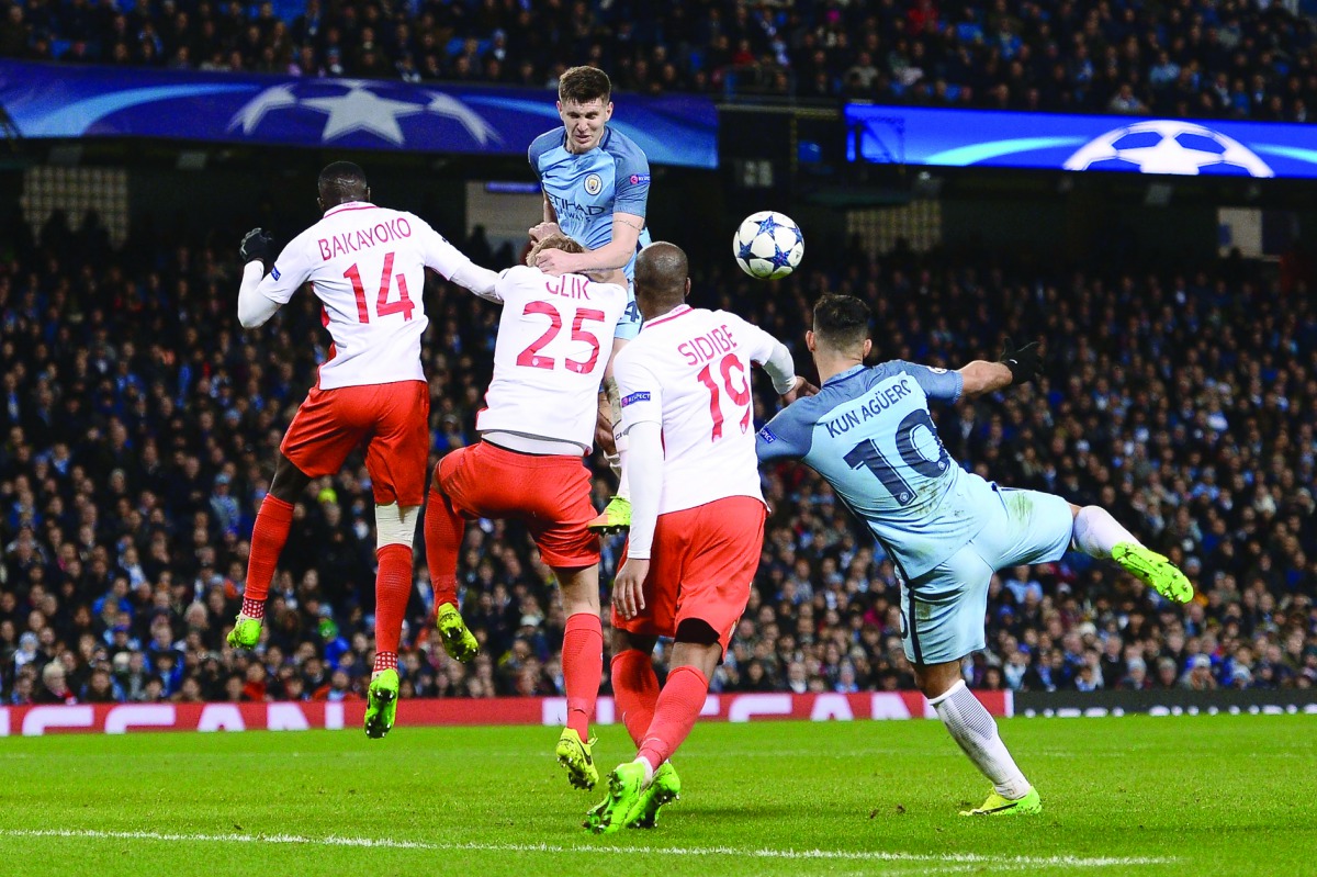 Manchester City's Argentinian striker Sergio Aguero (right) scores their third goal during the UEFA Champions League Round of 16 first-leg football match against Monaco at the Etihad Stadium in Manchester on Tuesday.