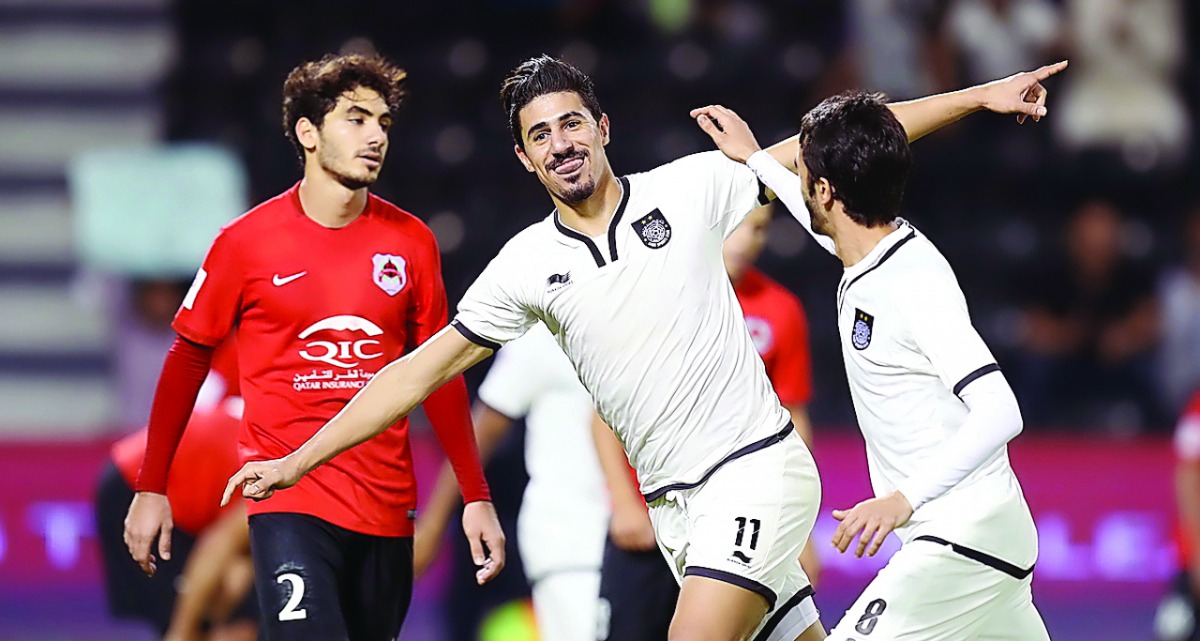 Al Sadd's Bagdad Bounedjah (centre) celebrates after scoring one of his three goals during El Clasico against Al Rayyan at Jassim Bin Hamad Stadium in this December 2016 file photo.