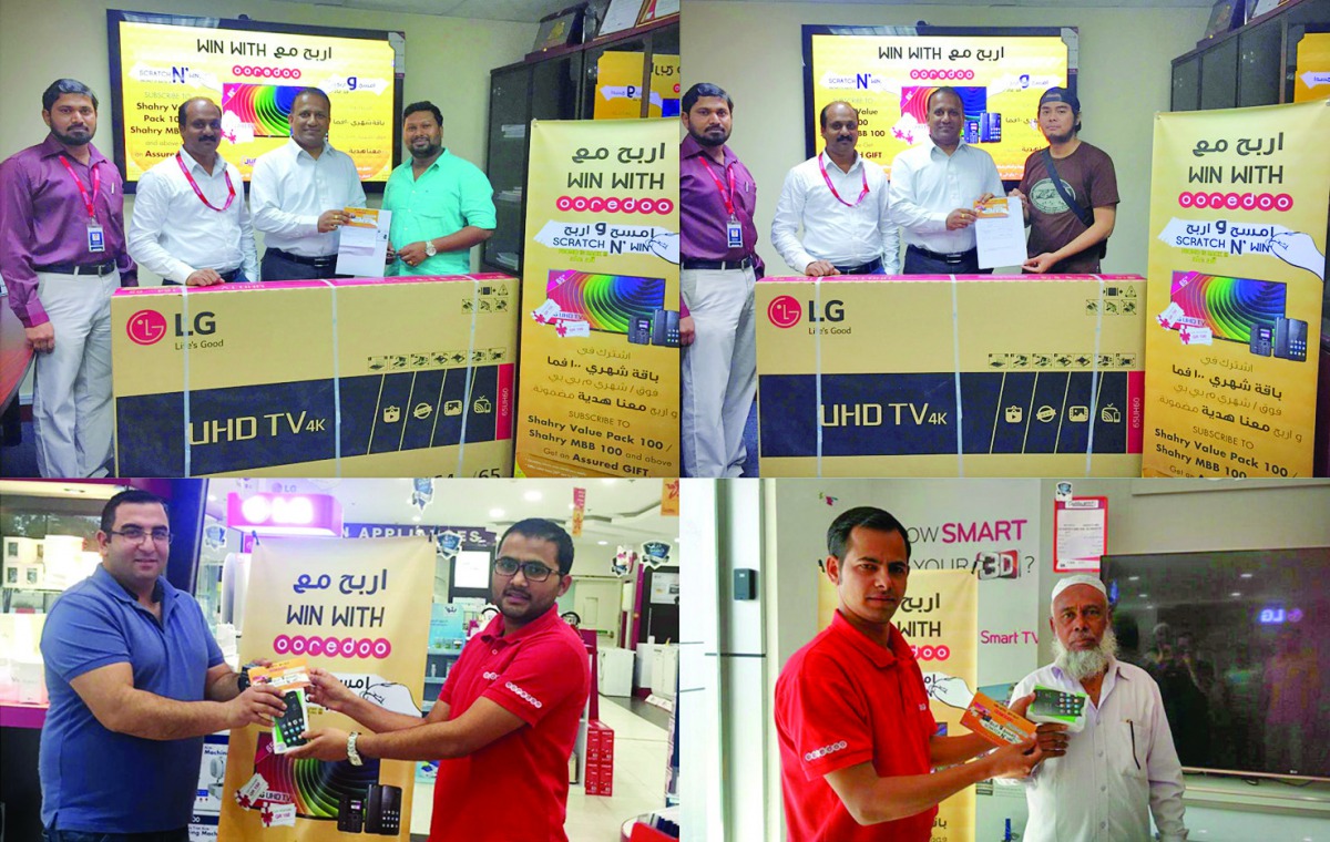 Winners of Jumbo Electronic's Scratch & Win promotion receiving prizes. 