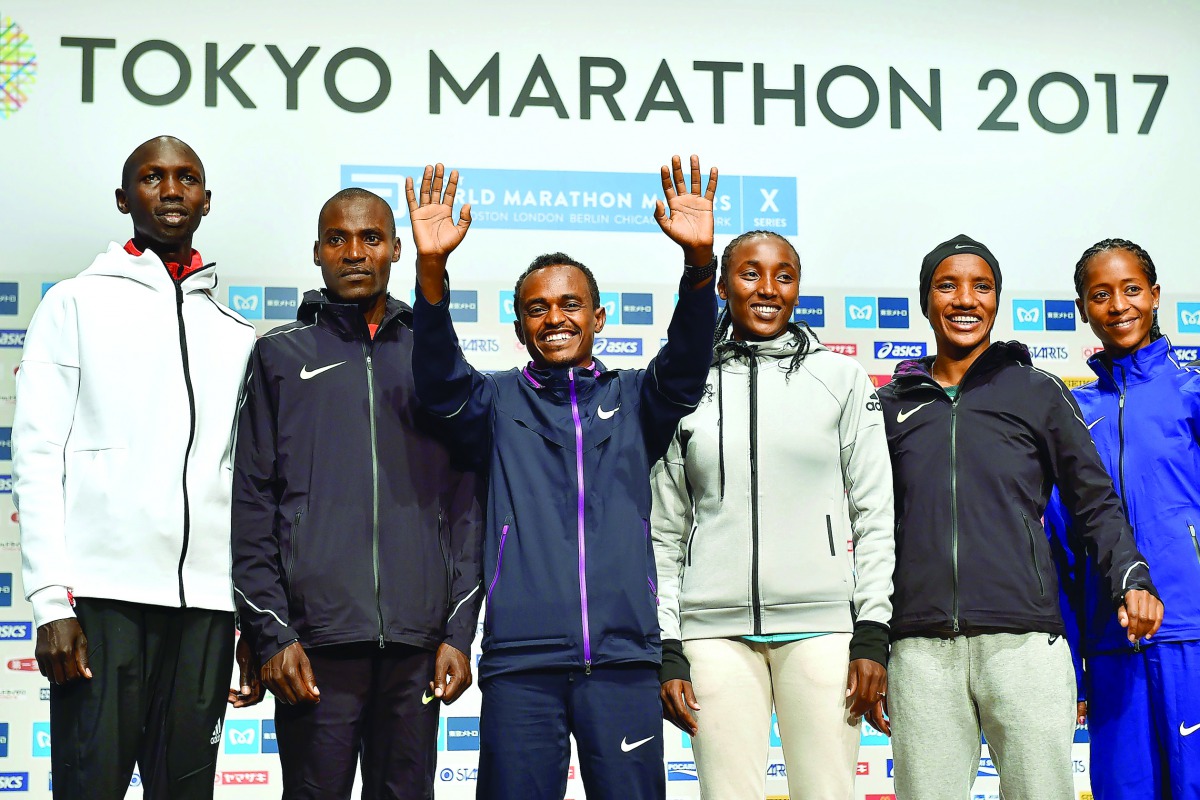 (From left) Kenya's Wilson Kipsang  and Dickson Chumba and Ethiopia's Tsegaye Kebede, Amane Beriso, Amane Gobena and Birhane Dibaba pose for a photograph during a joint press conference for this weekend's Tokyo marathon in Tokyo, Japan  yesterday. The ann