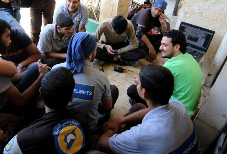 Civil Defence members, also known as the 'White Helmets', in a rebel held area of Aleppo, Syria October 7, 2016. (REUTERS/Abdalrhman Ismail/file photo)