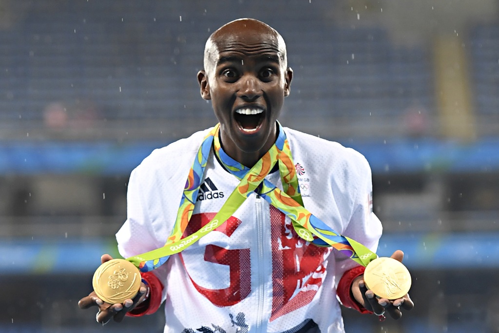 (FILES) This file photo taken on August 21, 2016 shows gold medallist Britain's Mo Farah celebrating near the podium for the Men's 5000m during the athletics event at the Rio 2016 Olympic Games at the Olympic Stadium in Rio de Janeiro on August 20, 2016. 