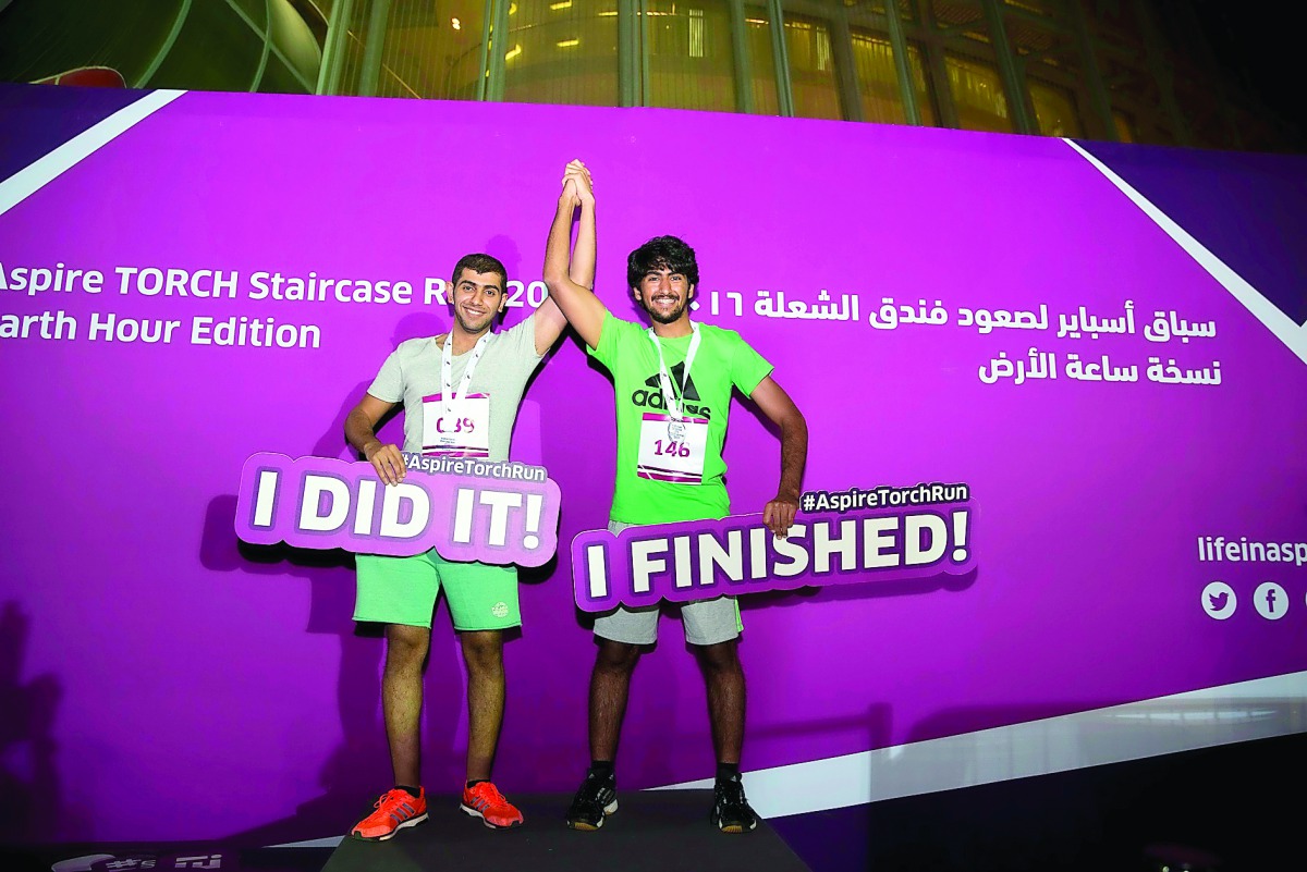 Participants celebrate reaching the top during ATSR 2016.