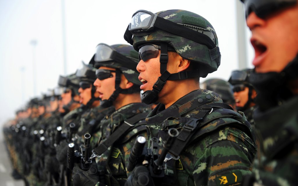 Paramilitary policemen stand in formation as they take part in an anti-terrorism oath-taking rally, in Kashgar, Xinjiang Uighur Autonomous Region, China, February 27, 2017. REUTERS/Stringer