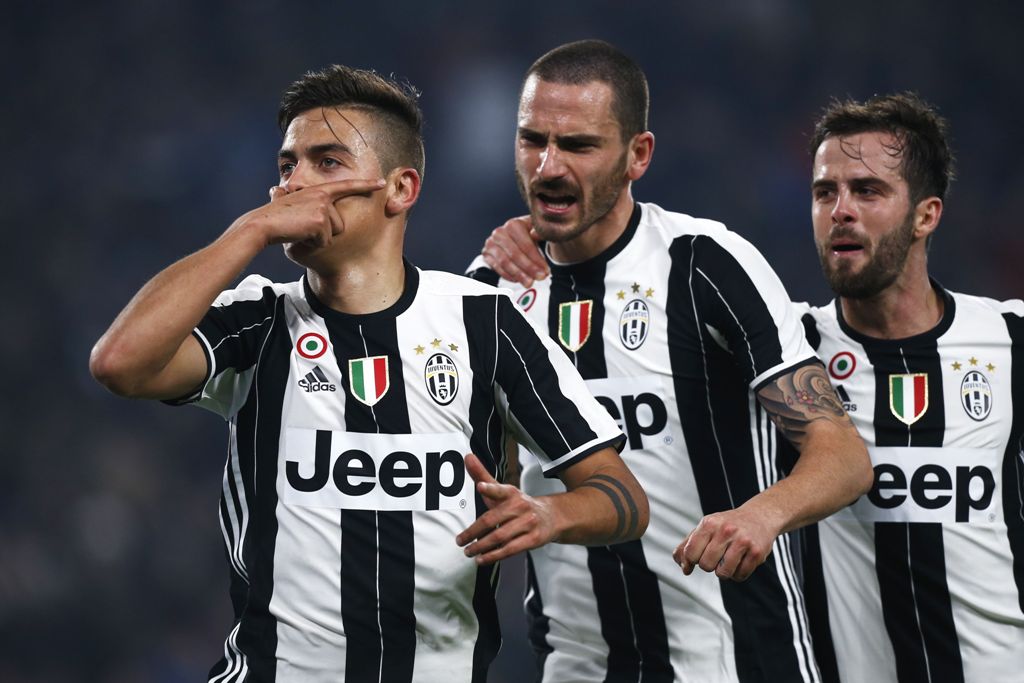 Juventus' forward Paulo Dybala from Argentina (L) celebrates after scoring with his teammates Juventus' defender Leonardo Bonucci (C) and Juventus' midfielder Morale Pijanic of Bosnia-Erzegovina during the Italian Tim Cup football match between Juventus a