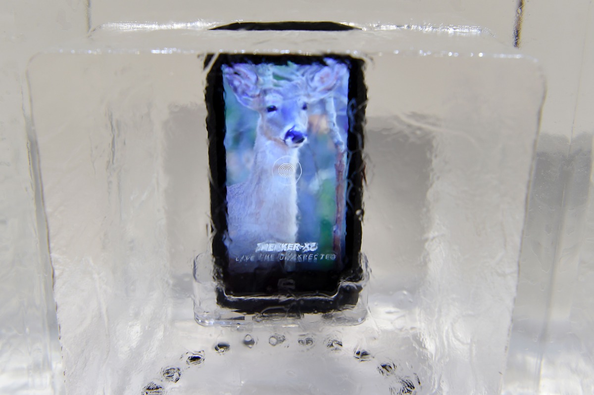 A Crosscall Trekker-X3 smartphone inside a block of ice on the first day of the Mobile World Congress in Barcelona on February 27 2017. Phones rugged enough to survive falling from the sky or resistant to foaming hand soap, just some of the special featur