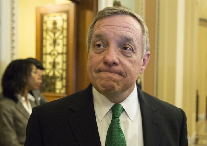Senator Richard Durbin (D-IL) speaks to reporters before a cloture vote on funding for the Department of Homeland Security on Capitol Hill in Washington February 25, 2015. REUTERS/Joshua Roberts