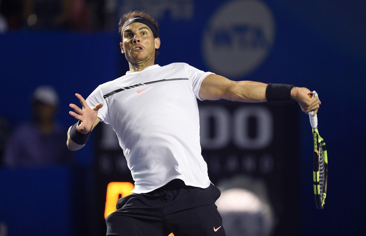 Spanish tennis player Rafael Nadal returns the ball to Marin Cilic of Croatia during the semi finals of the ATP Mexican Tennis Open, in Acapulco, Guerrero state, Mexico, yesterday.