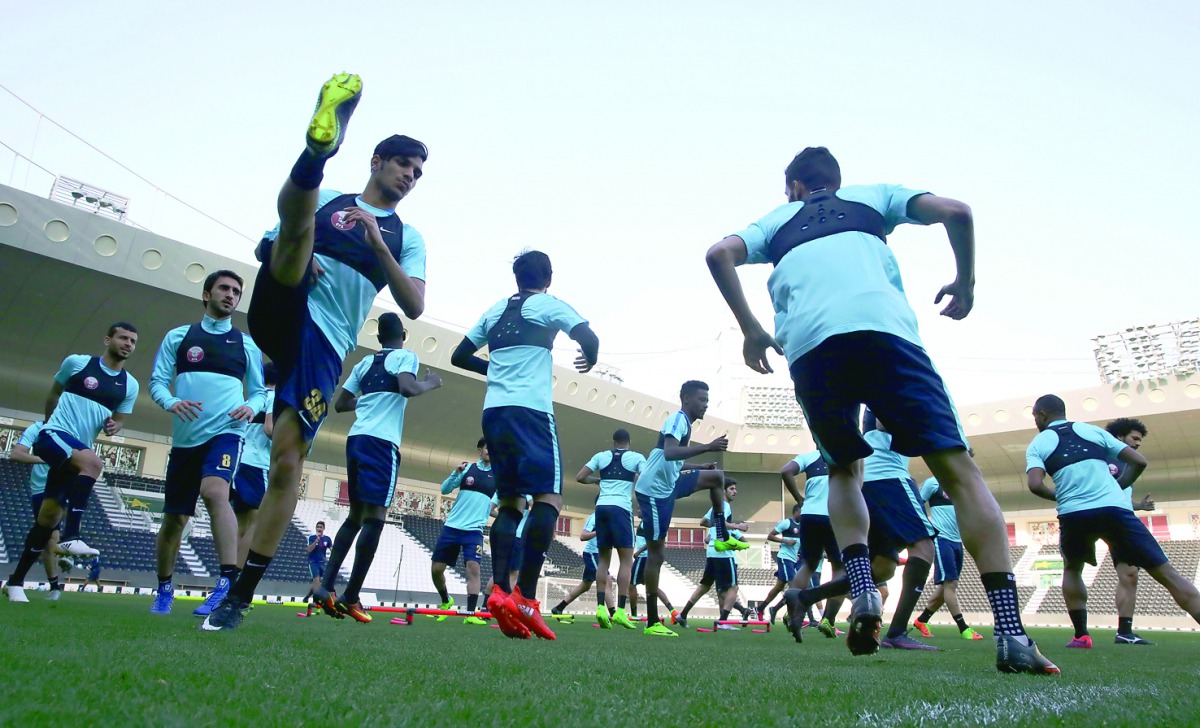 Qatar national team players take part in a training session under the watchful eyes of coach Jorge Fossati in Doaha yesterday. 