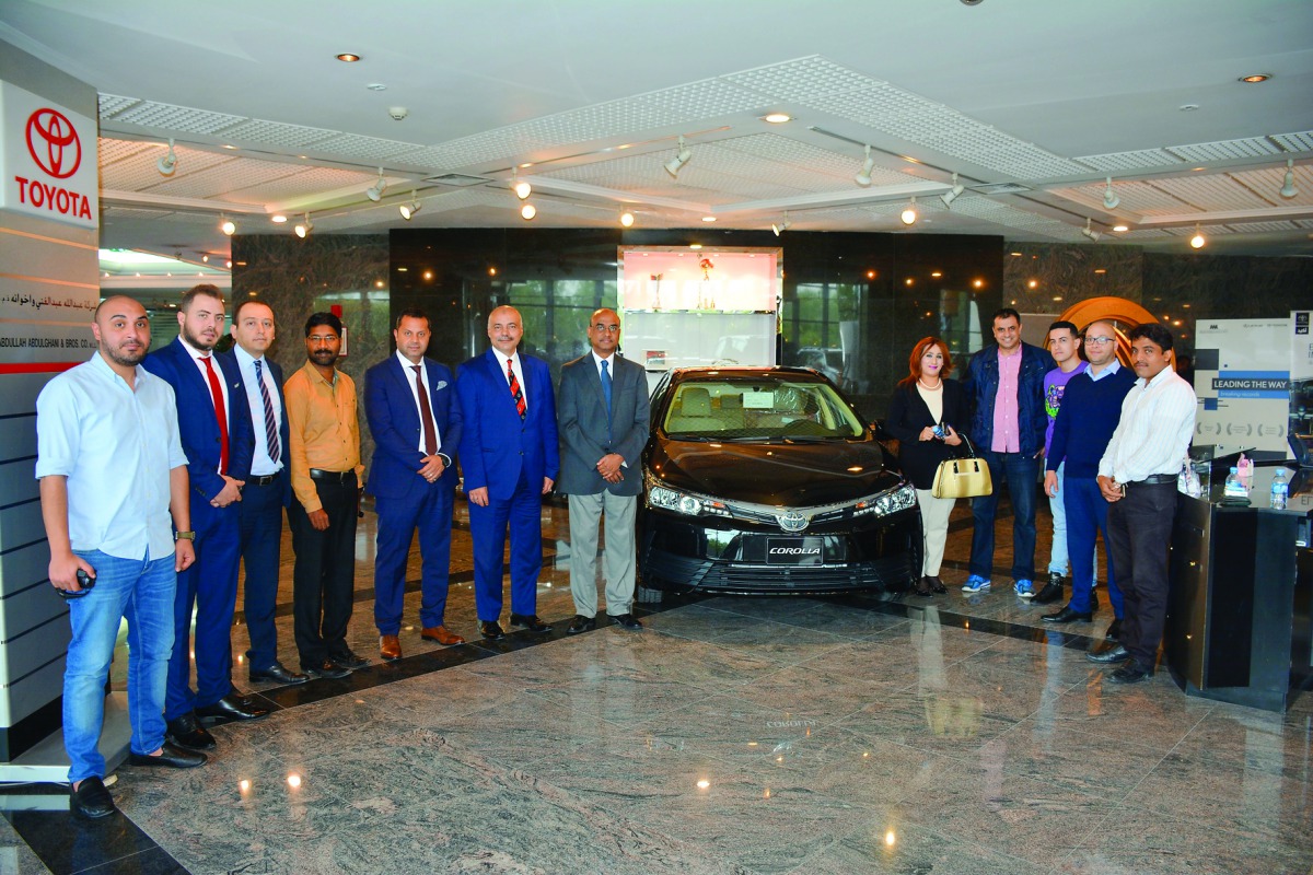 Officials of Abdullah Abdulghani and Bros with the new Toyota Corolla 2017 at the showroom.