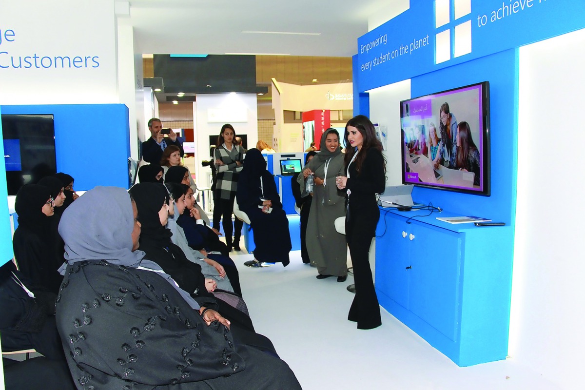 Visitors at the Microsoft booth at QITCOM.