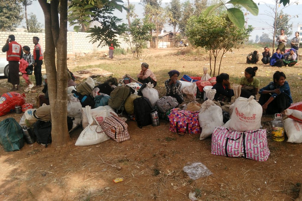 Displaced people are seen with their belongings after fighters of the Myanmar National Democratic Alliance Army (MNDAA) launched an attack on March 6 on police, military, and government sites in Laukkai, Myanmar March 8, 2017. Picture taken March 8, 2017.