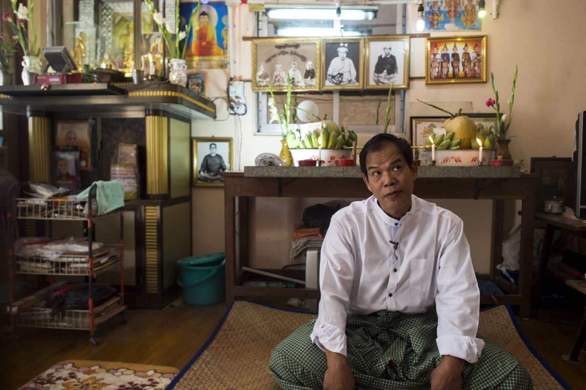 This photo taken on January 15, 2017 shows Zaw Min, a master from the popular sect of Shwe Yin Kyaw, talking during an interview at his house on the outskirts of Yangon.  AFP / Ye Aung Thu 