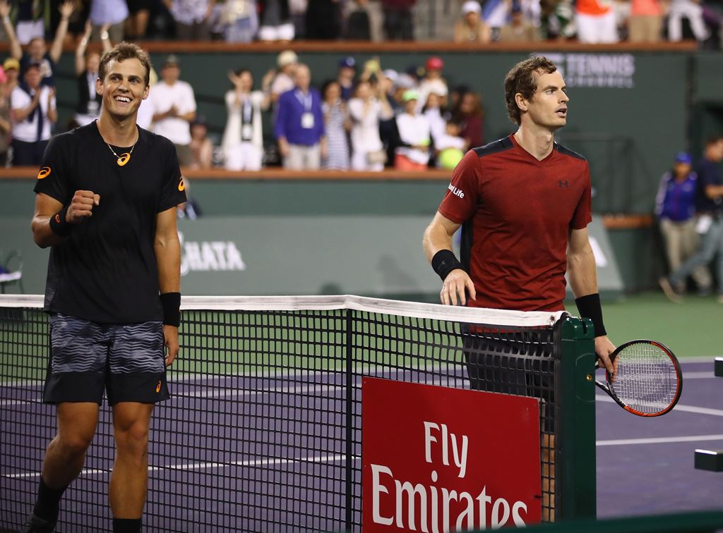 Vasek Pospisil of Canada celebrates after his straight sets victory against Andy Murray of Great Britain in their second round match during day six of the BNP Paribas Open at Indian Wells Tennis Garden on March 11, 2017 in Indian Wells, California. Clive 