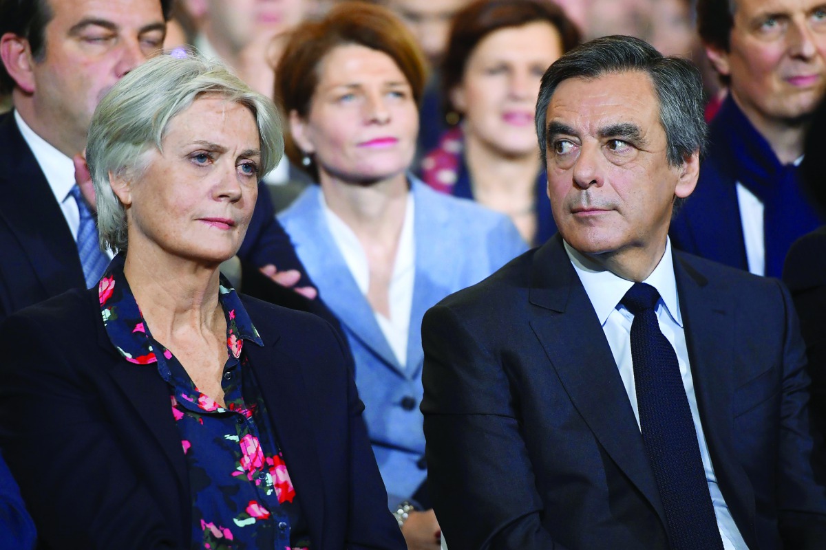A file photo of French right-wing candidate for the upcoming presidential election Francois Fillon and his wife Penelope during a campaign rally in Paris.