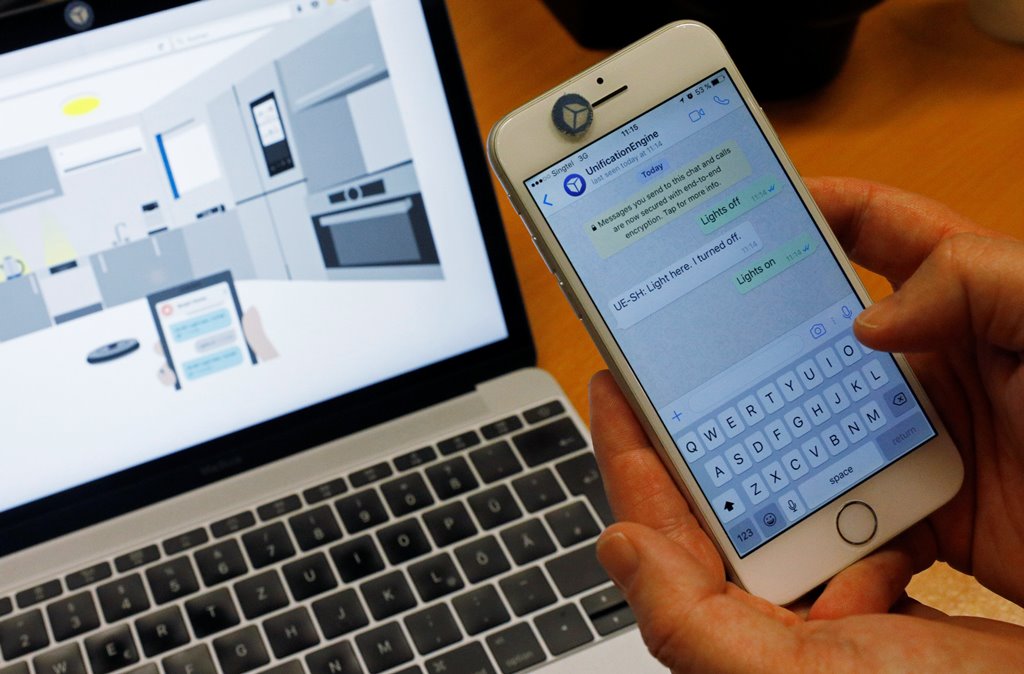 CEO of Unified Inbox Toby Ruckert demonstrates how he uses his smartphone to control electrical appliances in a simulation software in Singapore March 3, 2017. REUTERS/Edgar Su