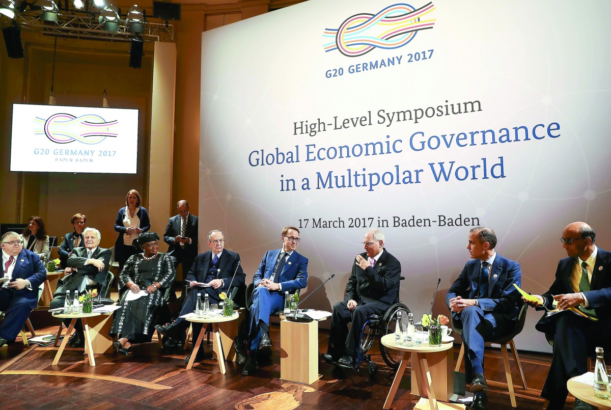 German Finance Minister Wolfgang Schaeuble (third right) speaks in a Symposium at the G20 Finance Ministers and Central Bank Governors Meeting in Baden-Baden, Germany.