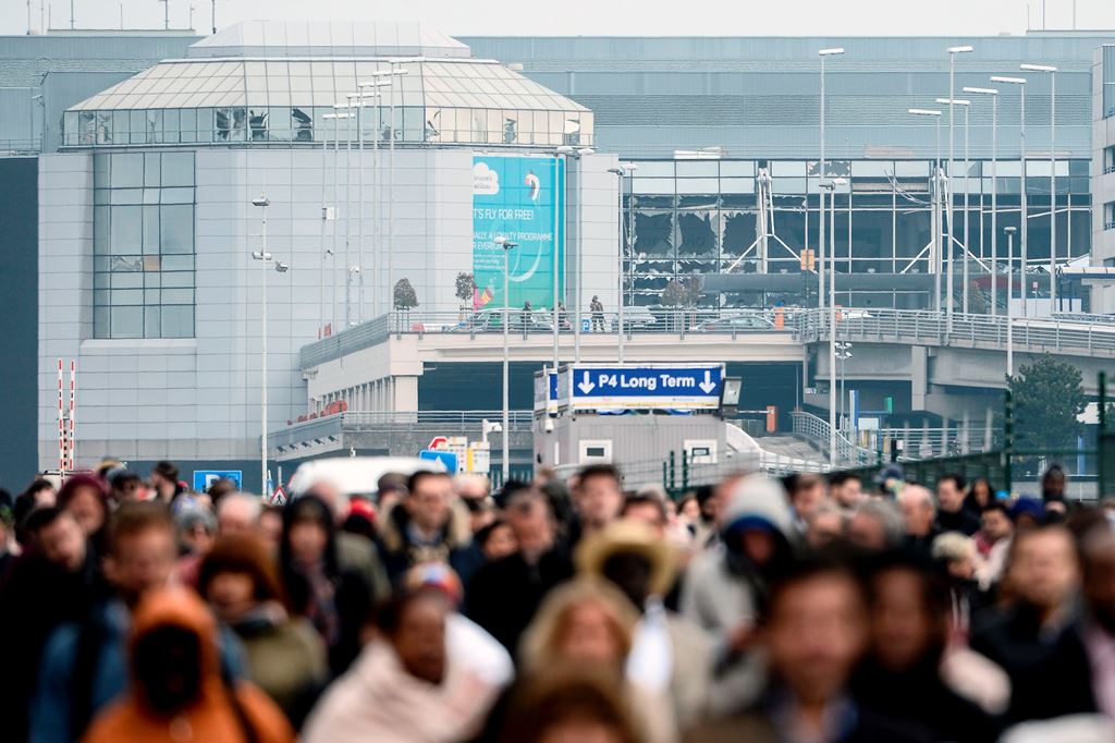 (FILES) This file photo taken on March 22, 2016 shows passengers evacuating the Brussels Airport, in Zaventem, after a string of explosions rocked Brussels airport and a city metro station. Belgium will mark on March 22, 2017, the first anniversary of dea
