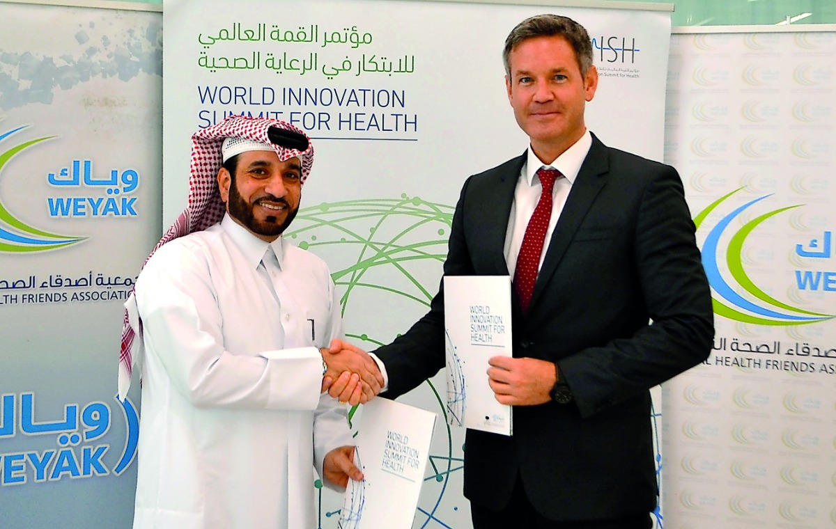 Mohammed Albinali, Executive Director, Weyak, and Egbert Schillings, Chief Executive Officer, WISH, after signing a Memorandum of Understating (MoU) to establish a cooperative framework to promote mental health in Qatar.