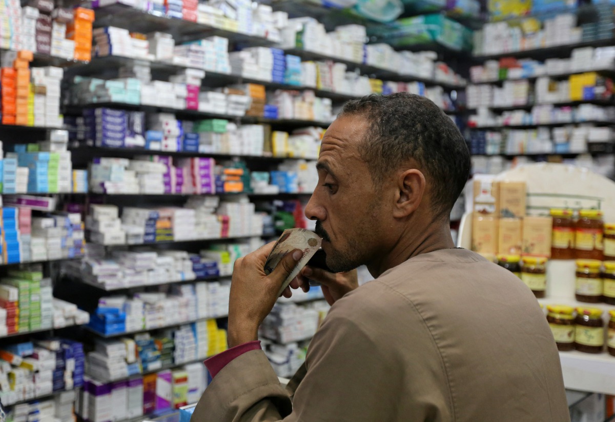 FILE PHOTO: A customer waits for his medicine in a pharmacy in downtown Cairo Egypt, November 17, 2016 ({REUTERS / Mohamed Abd El Ghany) 