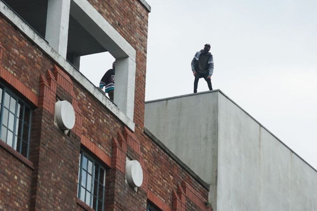 Men on the roof near FACT