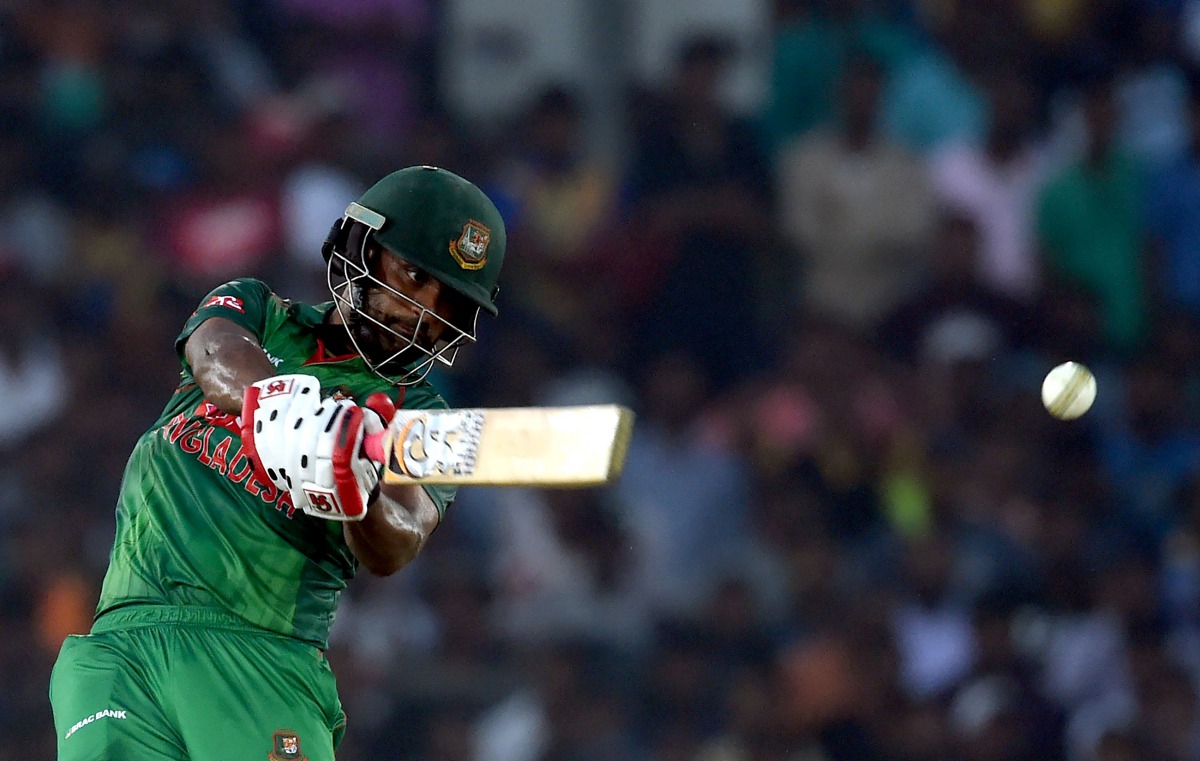 Bangladesh cricketer Tamim Iqbal plays a shot during the first one day international (ODI) cricket match between Sri Lanka and Bangladesh at The Rangiri Dambulla International Cricket Stadium in Dambulla on March 25, 2017. (AFP / Ishara S. KODIKARA)