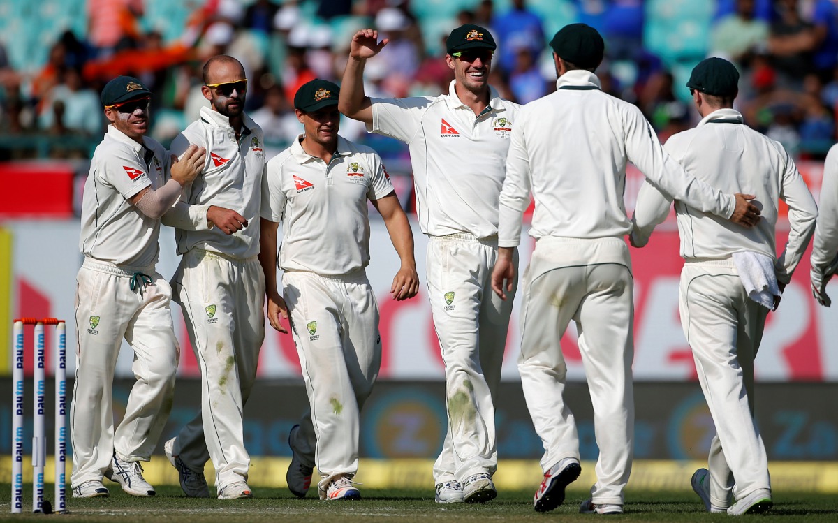 Australia's Nathan Lyon (2-L) celebrates with his team-mates after dismissing India's captain Ajinkya Rahane. (Reuters/Adnan Abidi)