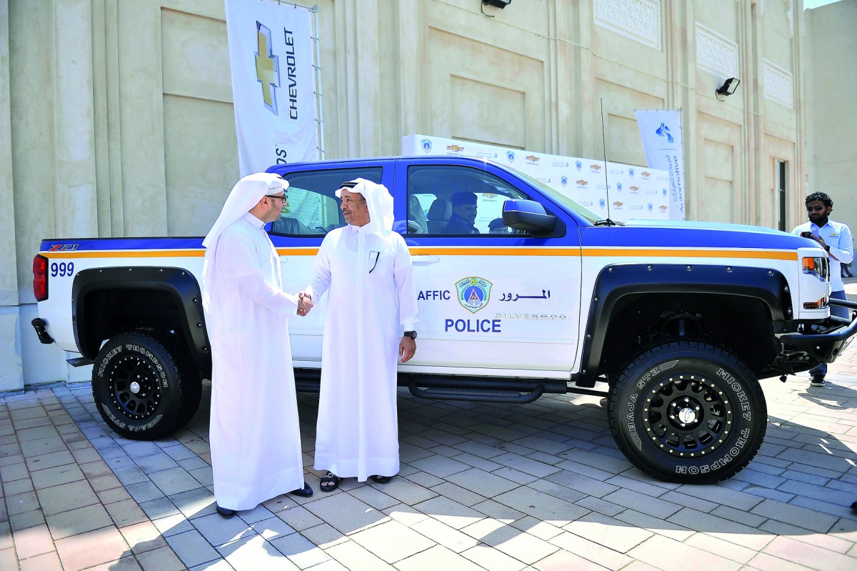 Mohamad Jaidah (left), Group Executive Director of Jaidah Group, and Brigadier Mohamed Saad Al Kharji, Director-General of the Traffic Department, during a ceremony to present a Chevrolet Silverado to the Traffic Department at the General Directorate of T