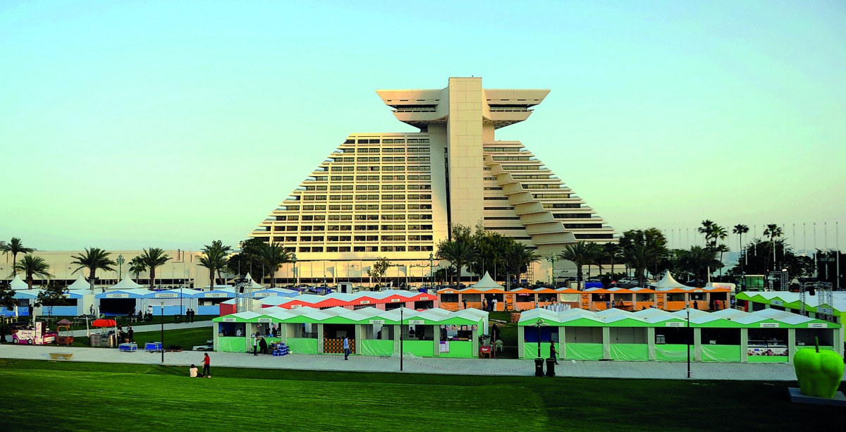 Food stalls getting ready for the eighth Qatar International Food Festival which opens today. Pic: Abdul Basit/ The Peninsula