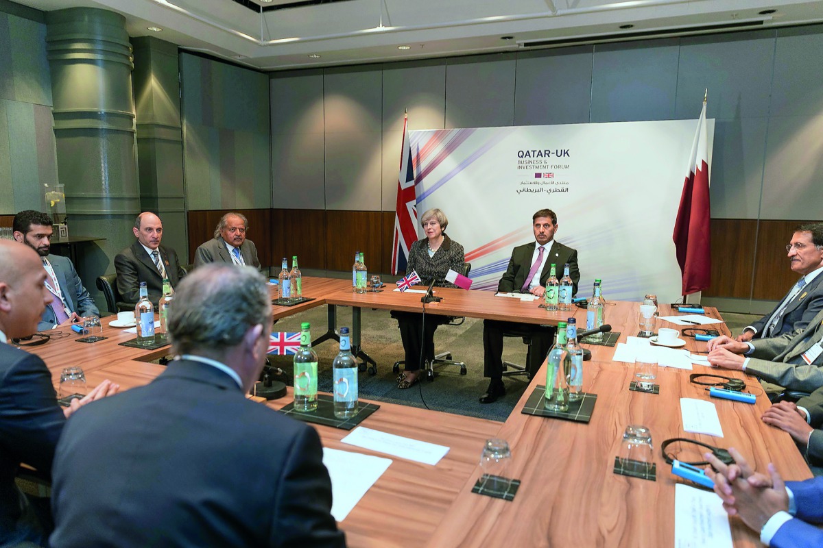 Prime Minister and Interior Minister H E Sheikh Abdullah bin Nasser bin Khalifa Al Thani and British Prime Minister Theresa May at a round table meeting with Qatari businessmen in Birmingham, yesterday.