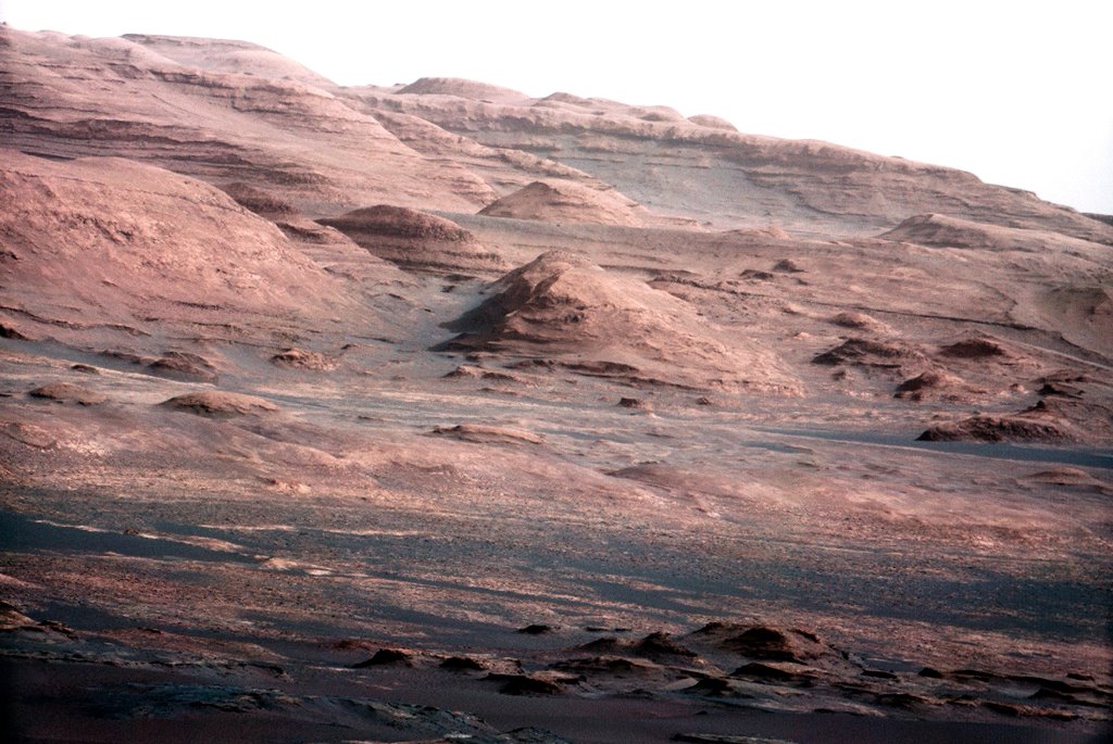 FILE PHOTO -- The base of Mars' Mount Sharp - the rover's eventual science destination - is pictured in this August 27, 2012 NASA handout photo taken by the Curiosity rover. The image is a portion of a larger image taken by Curiosity's 100-millimeter Mast