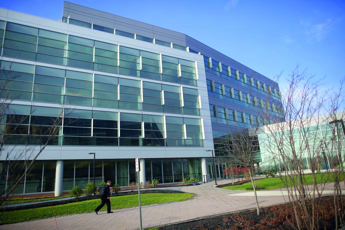 A man passes before Dupont corporate headquarters in Wilmington, Delaware, in the US.