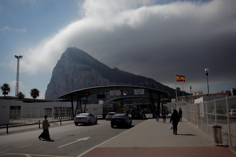 People enter the British territory of Gibraltar, historically claimed by Spain, at its border with Spain, in La Linea de la Concepcion, Spain March 29, 2017. REUTERS/Jon Nazca

