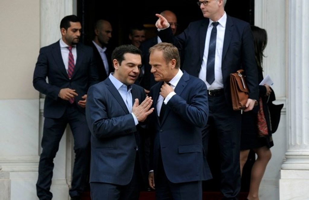 European Council President Donald Tusk (R) speaks with Greek Prime Minister AlexisTsipras as he leaves the Maximos Mansion in Athens, Greece, April 5, 2017. REUTERS/Michalis Karagiannis.