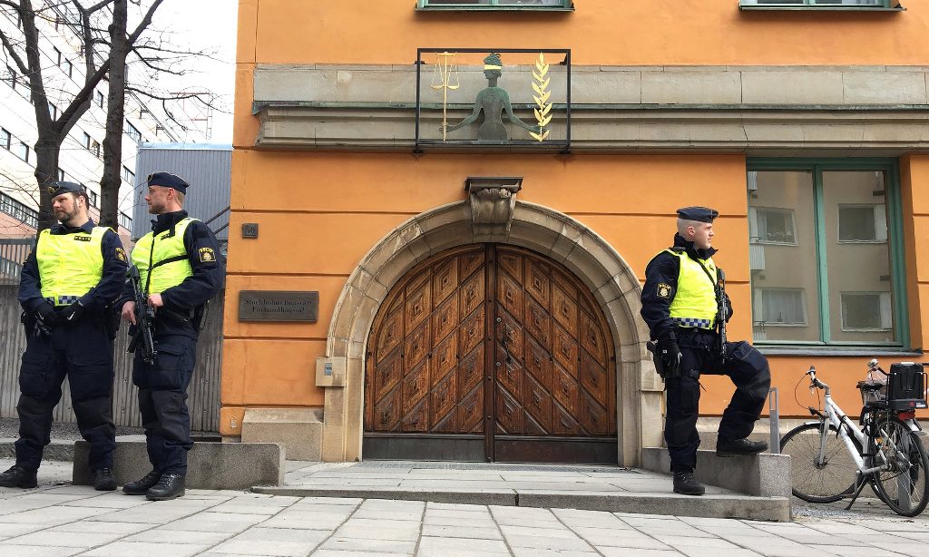 Policemen guard Stockholm district court before the detention of Rakhmat Akilov, the suspect in Friday’s deadly attack. Photograph: Reuters.