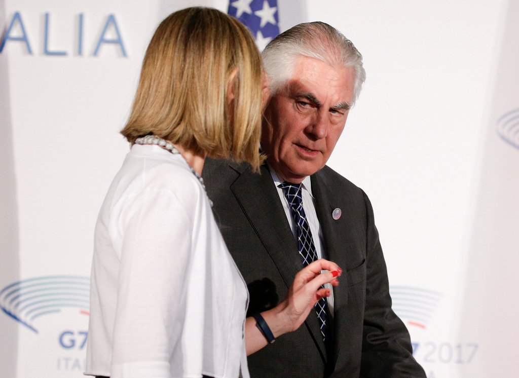 U.S. Secretary of State Rex Tillerson talks with E.U. High Representative for Foreign Affairs Federica Mogherini as they arrive to pose for a family photo during a G7 for foreign ministers in Lucca, Italy April 11, 2017. REUTERS/Max Rossi
