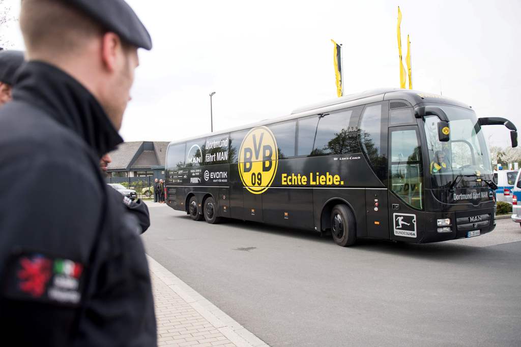 A team bus of German first division Bundesliga football club Borussia Dortmund arrives at the club's training grounds in Brackel near Dortmund, western Germany, on April 12, 2017, one day after an attack on Borussia Dortmund's team bus.  AFP /  Marius Bec