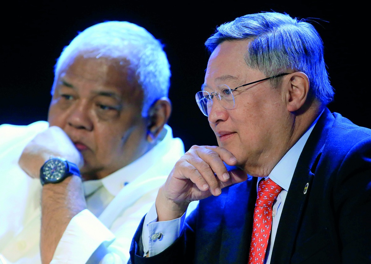 Philippine Finance Secretary Carlos Dominguez (R) with Executive Secretary Salvador Medialdea during a 