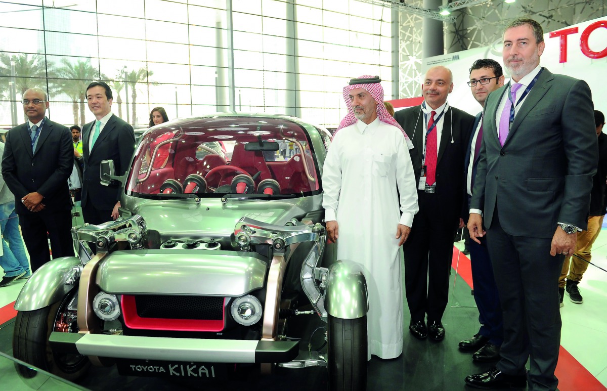 Officials with the Toyota KIKAI model at the Qatar Motor Show.  Pic:  Salim Matramkot / The Peninsula