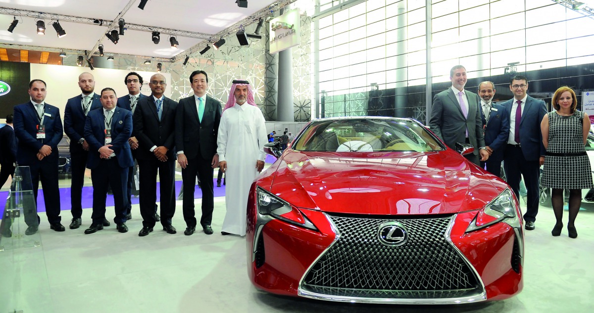 Officials with the Lexus model at the Qatar Motor Show. Pic:  Salim Matramkot / The Peninsula 