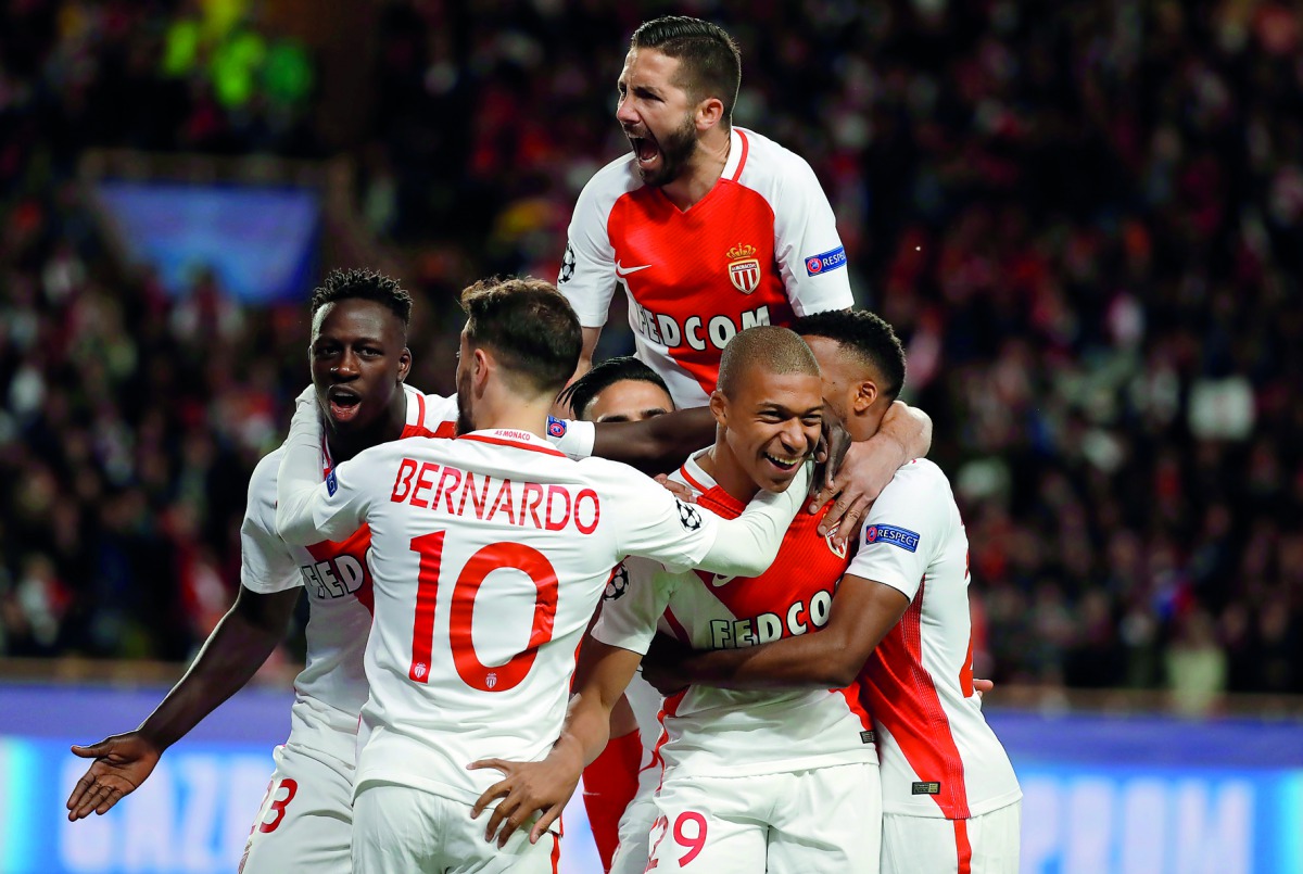 Monaco's Kylian Mbappe Lottin celebrates after scoring their first goal with team mates during their UEFA Champions League Quarter Final second leg match against Borussia Dortmund. 