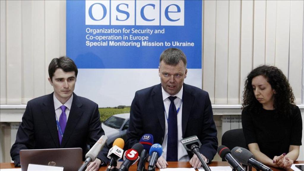 KIEV, UKRAINE - APRIL 23 : Deputy Chief Monitor of the Organization for Security and Co-operation in Europe (OSCE) Special Monitoring Mission to Ukraine Alexander Hug (C) speaks to media about today's OSCE car explosion in Ukraine during a press conferenc
