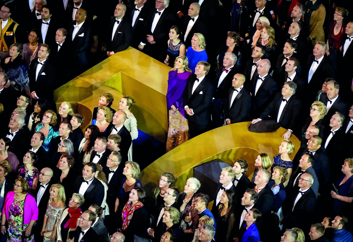 Hundreds of people pose for a picture with Queen Maxima and King Willem-Alexander (centre) after a dinner with 150 fifty-year-old Dutch people who were invited on the occasion of the 50th birthday of the King at the Royal Palace in Amsterdam, late on Frid
