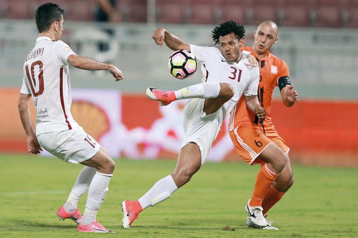 El Jaish's Romarinho (centre) kicks to score during their Emir Cup Quarter-final match against Umm Salal, played at Lekhwiya Stadium yesterday. El Jaish beat Umm Salal  5-3 to reach the semi-finals.