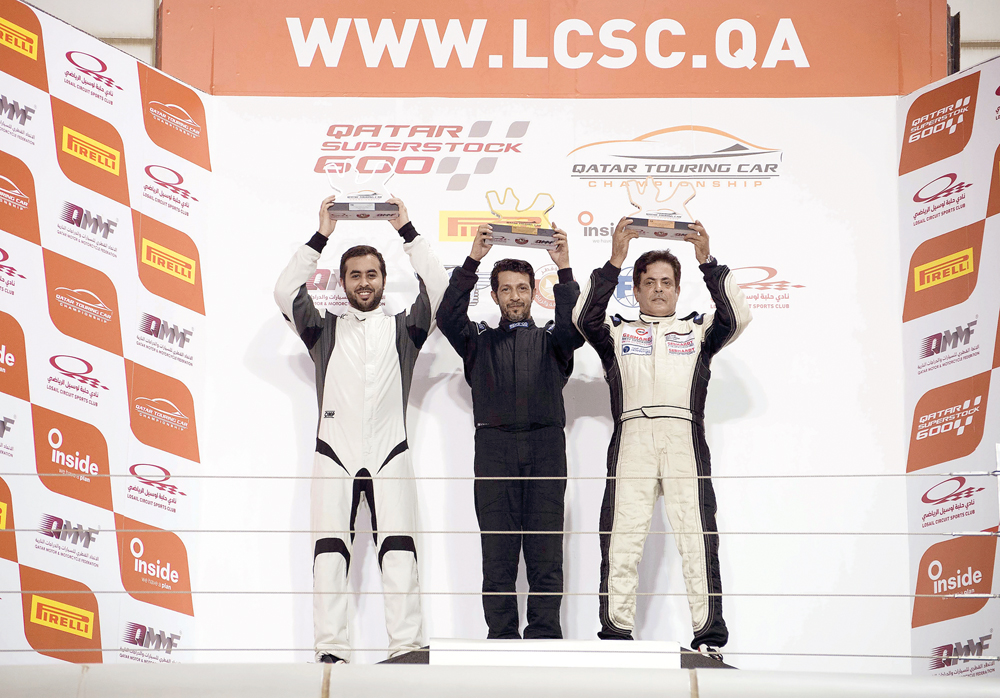 Abdullah Al Khelaifi, Mahmoud Al Khalaf and Saadon Al Kuwari, the podium winners at fifth round of the Qatar Touring Car Championship celebrate on the podium at the Losail International Circuit on Saturday.