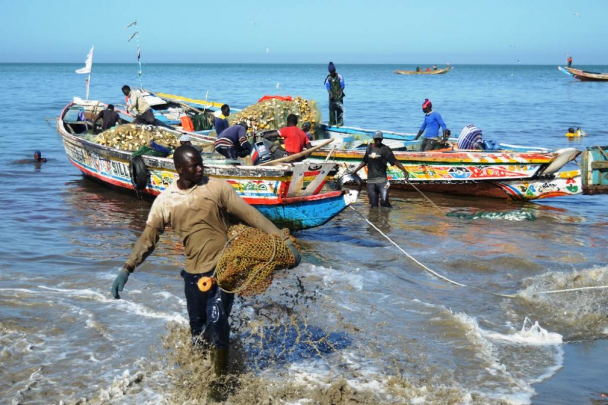 Fishermen land on a beach at Joal-Fadiouth, Senegal, on April 25, 2017. Thomson Reuters Foundation/Kieran Guilbert