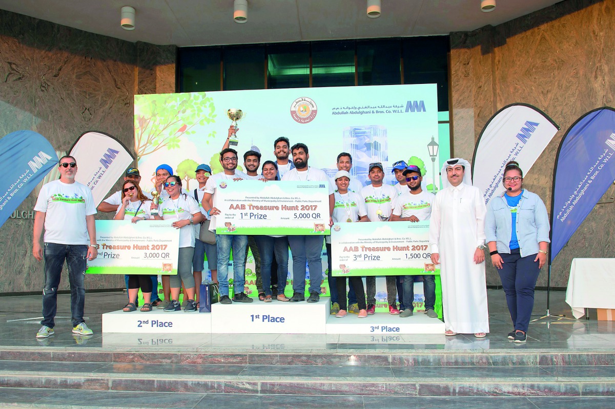 Winners of the AAB Treasure Hunt with their prizes. The event is a CSR initiative promoting public parks in Qatar while reminding the participants to observe road safety practices.