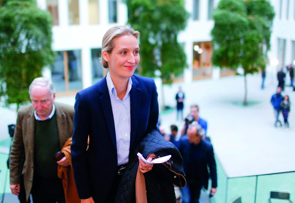 Alice Weidel (right) and Alexander Gauland of the anti-immigration party Alternative for Germany (AFD) arrive for a meeting after the Schleswig-Holstein regional state elections, in Berlin, yesterday.
