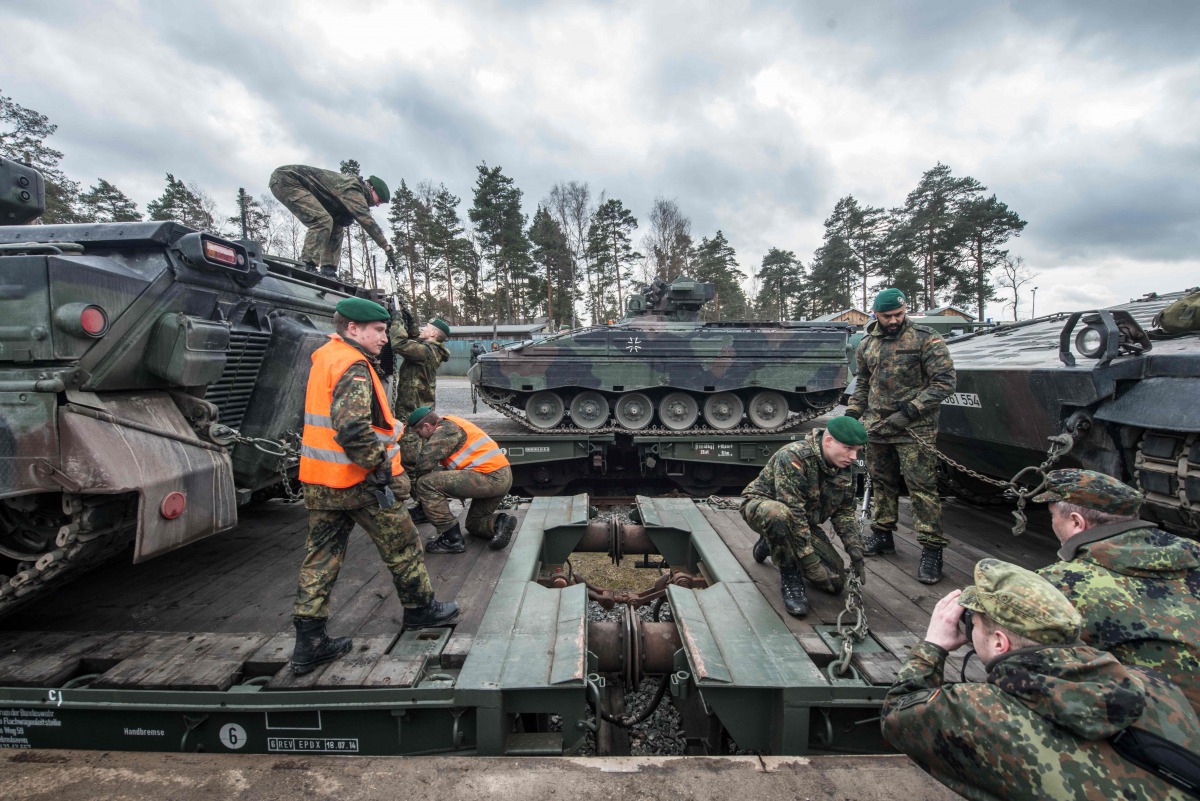 FILE PHOTO: German soldiers load Marder type armored vehicles on a train at the troop exercise area in Grafenwoehr, southern Germany, on February 21, 2017 (AFP / dpa / Armin Weigel) 