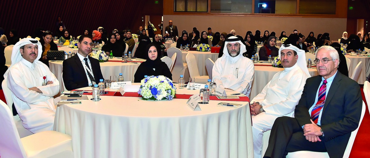 Officials, QU faculty and school teachers at the Forum.